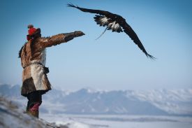 A member of Mongolia’s Kazakh ethnic group releases an eagle during the Spring Golden Eagle Festival in Ulaanbaatar.