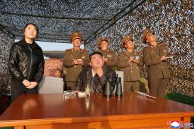 In a photo released by North Korea’s official Korean Central News Agency, North Korean leader Kim Jong Un is accompanied by his daughter, Kim Ju Ae, as he oversees test launches of short-range ballistic missiles.
