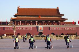 Sanitation workers lined up to work in front of Tiananmen Square before a plenary session of China’s National People’s Congress at the Great Hall of the People in Beijing.