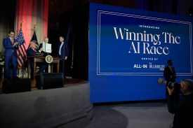 U.S. President Donald Trump displays a signed executive order during the "Winning the AI Race" summit hosted by All‑In Podcast and Hill & Valley Forum at the Andrew W. Mellon Auditorium on July 23, 2025 in Washington, DC.