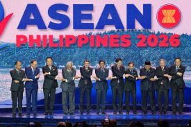 Leaders of the 11 members in the Association of Southeast Asian Nations hold hands for a group photo.