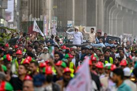 Jamaat-e-Islami party leader Shafiqur Rahman waves to supporters during a rally in Dhaka, Bangladesh, on Feb. 9.
