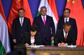 Hungary's Prime Minister Viktor Orban, Hungary's Foreign Minister Peter Szijjártó, China's Deputy Party Secretary and Governor of Guangdong Wang Weizhong with BYD Group Chairman and President Wang Chuanfu and Executive Vice President Li Ke sign an agreement during a joint press conference in the Prime Minister’s office in Budapest, Hungary, on May 15, 2025.