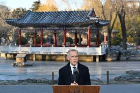 Canadian Prime Minister Mark Carney speaks during a press conference in Beijing.