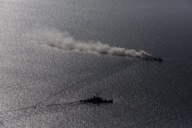 Navy boats seen from above at sea.