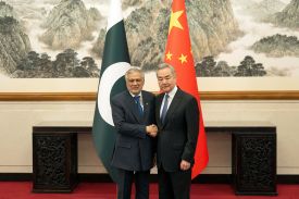 Chinese Foreign Minister Wang Yi shakes hands with Pakistani Foreign Minister Ishaq Dar in Beijing on March 31.