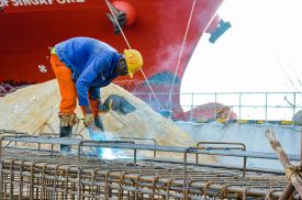 A Cameroonian construction worker, employed by a Chinese firm, works at the Kribi Deepwater Port in Cameroon.
