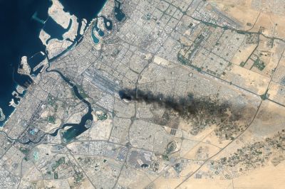 A satellite view of Dubai International Airport on March 16 after a drone strike ignited a fuel tank fire, causing global travel disruptions.