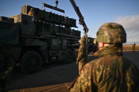 German soldiers unload the U.S.-made MIM-104 Patriot surface-to-air missile system in Jasionka, Poland, on Jan. 23, 2025.