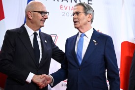 French Finance Minister Roland Lescure (left) shakes hands with U.S. Treasury Secretary Scott Bessent.