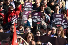 Participants display placards of Germany's Die Linke party during a demonstration in Berlin on Sept. 27, 2025.