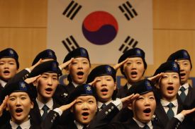 South Korean university students salute during an establishment ceremony of the Reserve Officer Training Corps (ROTC) for female cadets at Sookmyung Women's University on December 10, 2010 in Seoul.