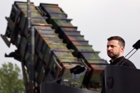 Volodymyr Zelensky, President of Ukraine, stands in front of a Patriot anti-aircraft missile system during his visit to a military training area on June 11, 2024 in Mecklenburg, Germany.