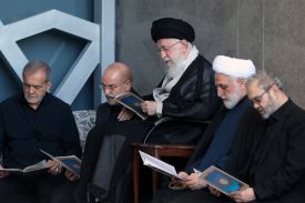 Iranian Supreme leader Ali Khamenei is alongside Iran's President Masoud Pezeshkian, Parliament Speaker Mohammad Bagher Ghalibaf, Judiciary Chief Mohsen Ejeie, and Hezbollah representative in Iran Abdallah Safieddine reading the Koran during the Friday prayer ceremony on October 04, 2024 in Tehran.