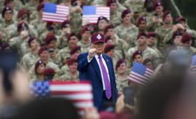 U.S. President Donald Trump pumps his fist to the crowd at a rally with U.S. Army troops at Fort Bragg, North Carolina.