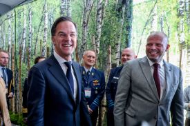 NATO Secretary-General Mark Rutte (left) and Belgian Defense Minister Theo Francken (right) attend the Brussels European Defense Exhibition and Conference in Brussels on March 12.