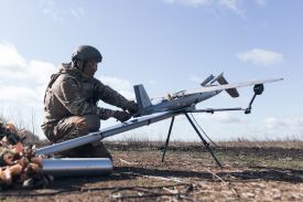 A Ukrainian soldier from the Taifun unmanned aerial vehicle unit prepares a new strike drone for flight in the Kharkiv region of Ukraine on April 7.