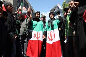 People hold portraits of Iran's slain supreme leader Ayatollah Ali Khamenei and his son and successor Mojtaba Khamenei during a rally to commemorate his death in Tehran on April 9, 2026.
