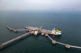 An oil tanker unloads imported crude oil in Qingdao, China.