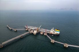 An oil tanker unloads imported crude oil in Qingdao, China.