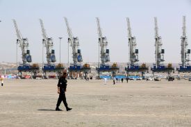 A police officer walks during an inauguration ceremony of new equipment and infrastructure at Shahid Beheshti Port in Chabahar, Iran.