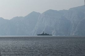 A navy vessel is seen sailing in the Strait of Hormuz.