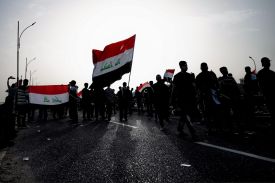 People gather for a demonstration of solidarity with Iran and to denounce the U.S.-Israeli war against it in Basra, Iraq.