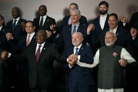 Vietnam's Prime Minister Pham Minh Chinh, Cuba's President and First Secretary Miguel Diaz-Canel, Bolivia's President Luis Arce Catacora, South Africa's President Cyril Ramaphosa, Brazil's President Luiz Inacio Lula da Silva, and India's Prime Minister Narendra Modi pose for a family photo during the BRICS summit in Rio de Janeiro, Brazil, on July 7, 2025.