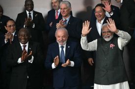 Indian Prime Minister Narendra Modi (first row, right) and other officials pose during the BRICS leaders' summit in Rio de Janeiro on July 7, 2025.