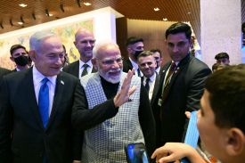 Israeli Prime Minister Benjamin Netanyahu and Indian Prime Minister Narendra Modi greet children in the Knesset in Jerusalem on Feb. 25.