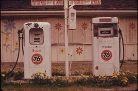 Two gas pumps, with "No Gas" written on them, are seen at a gas station in 1974.