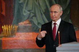 Russian President Vladimir Putin makes the sign of the cross during an Orthodox Easter service in Moscow.