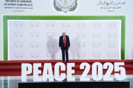 President Donald Trump waits to greet leaders during a summit to support ending the Israel-Hamas war in Sharm El Sheikh, Egypt, on Oct. 13, 2025.