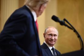 Donald Trump faces away from the camera as he looks at Vladimir Putin.