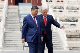 U.S. President Donald Trump gestures for Chinese President Xi Jinping to walk in front of him while visiting the Temple of Heaven in Beijing.