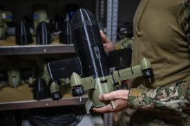 A Ukrainian soldier holds an interceptor drone used to protect against Russian drone attacks