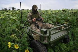 A Ukrainian serviceman controls an unmanned ground vehicle in eastern Ukraine, Aug. 11, 2025.