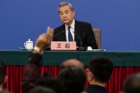 Chinese Foreign Minister Wang Yi looks on during a press conference in Beijing on March 8.