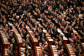Delegates applaud during a plenary session of China's National People's Congress.